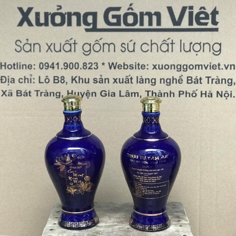 chai-ruou-in-logo-dang-mai-binh-nap-vang-men-xanh-hoa-tiet-ve-vang